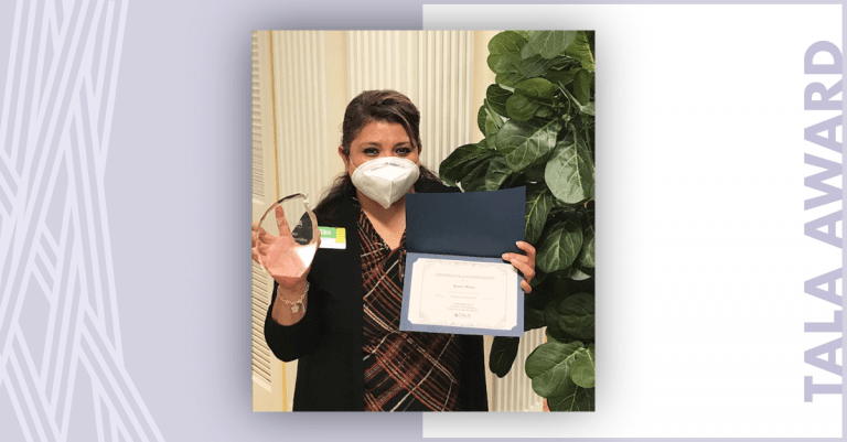 Atria Senior Living employee smiling after winning the TALA Award.